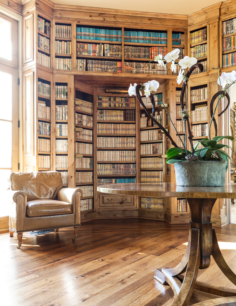 Photo of a mediterranean family room in Dallas with a library.