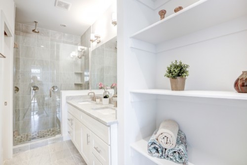 Alcove shower - mid-sized transitional master gray tile and ceramic tile ceramic tile alcove shower idea in DC Metro with shaker cabinets, white cabinets, white walls, an undermount sink and marble countertops