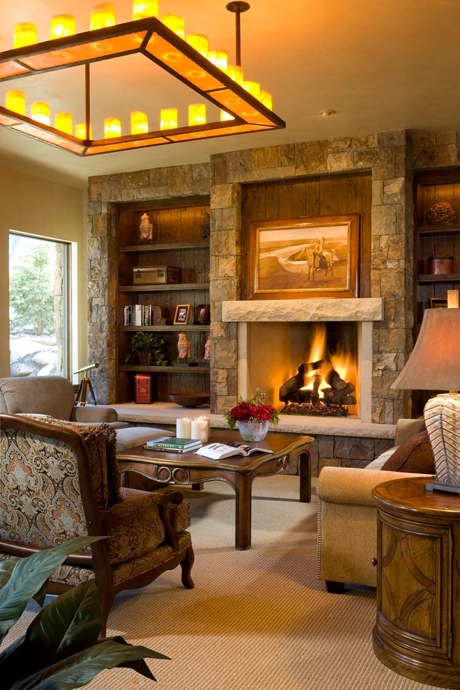 Design ideas for an expansive traditional open concept family room in Denver with a home bar, beige walls, carpet, a standard fireplace, a stone fireplace surround and a wall-mounted tv.