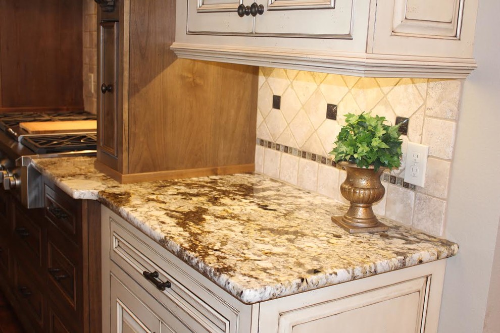 Inspiration for a large transitional eat-in kitchen remodel with granite countertops, brown backsplash and stone tile backsplash