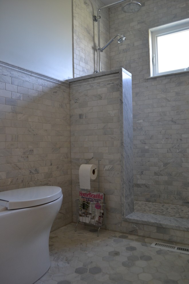 Photo of a mid-sized traditional master bathroom in New York with recessed-panel cabinets, grey cabinets, an alcove shower, gray tile, multi-coloured tile, white tile, subway tile, white walls, ceramic floors, an undermount sink and marble benchtops.