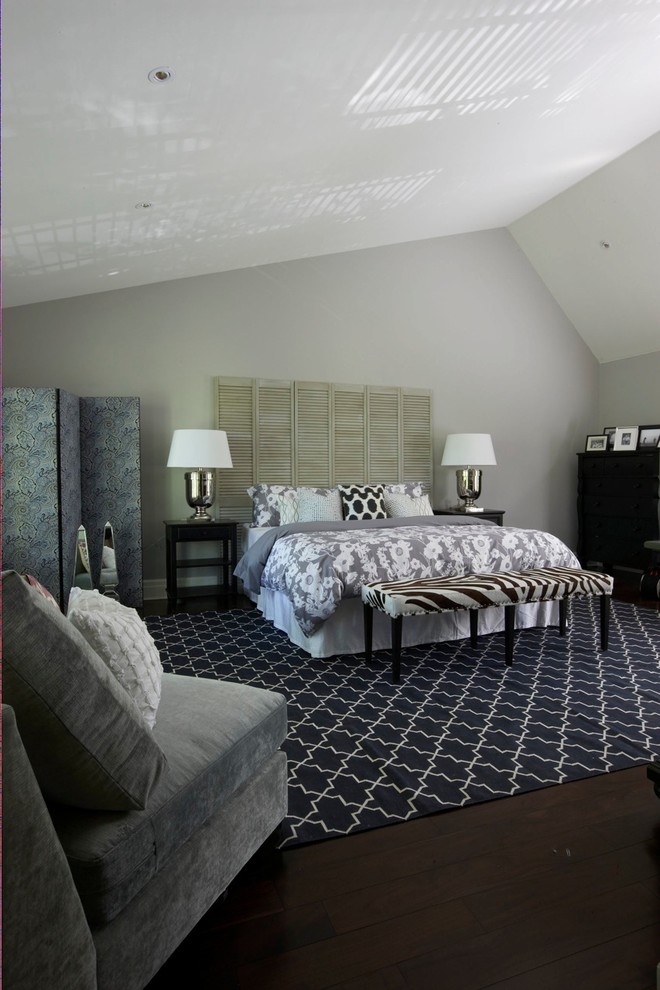 Contemporary bedroom in Toronto with grey walls and dark hardwood floors.