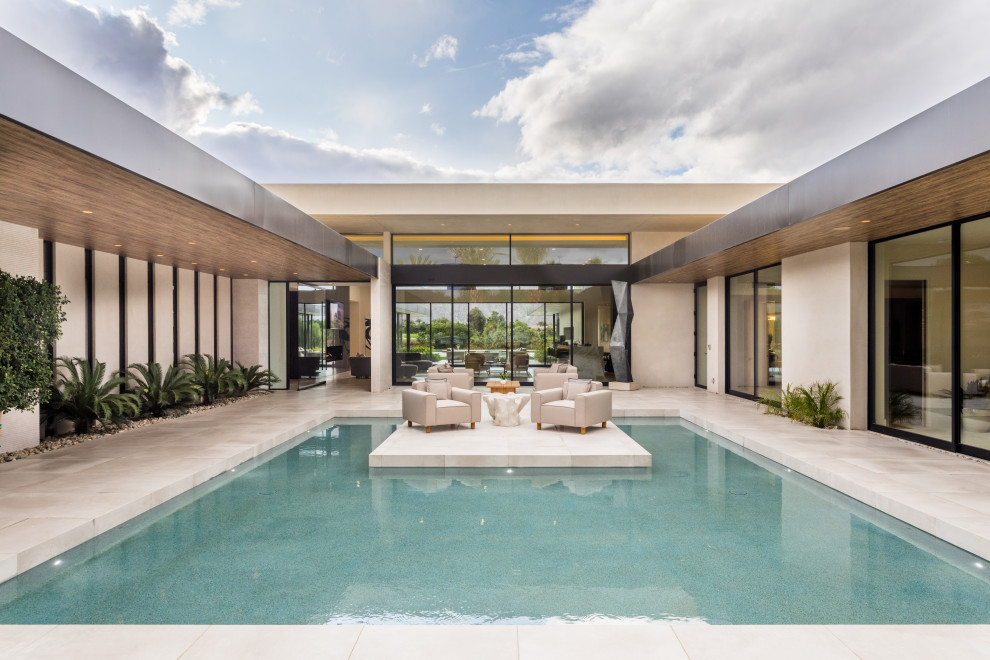 Photo of a large contemporary pool in Orange County.