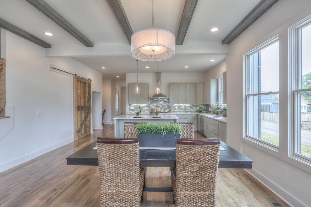 Great room - mid-sized transitional medium tone wood floor great room idea in Nashville with white walls
