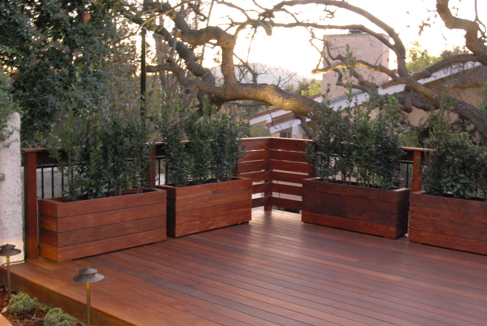 This is an example of a small contemporary backyard deck in Los Angeles with a container garden.