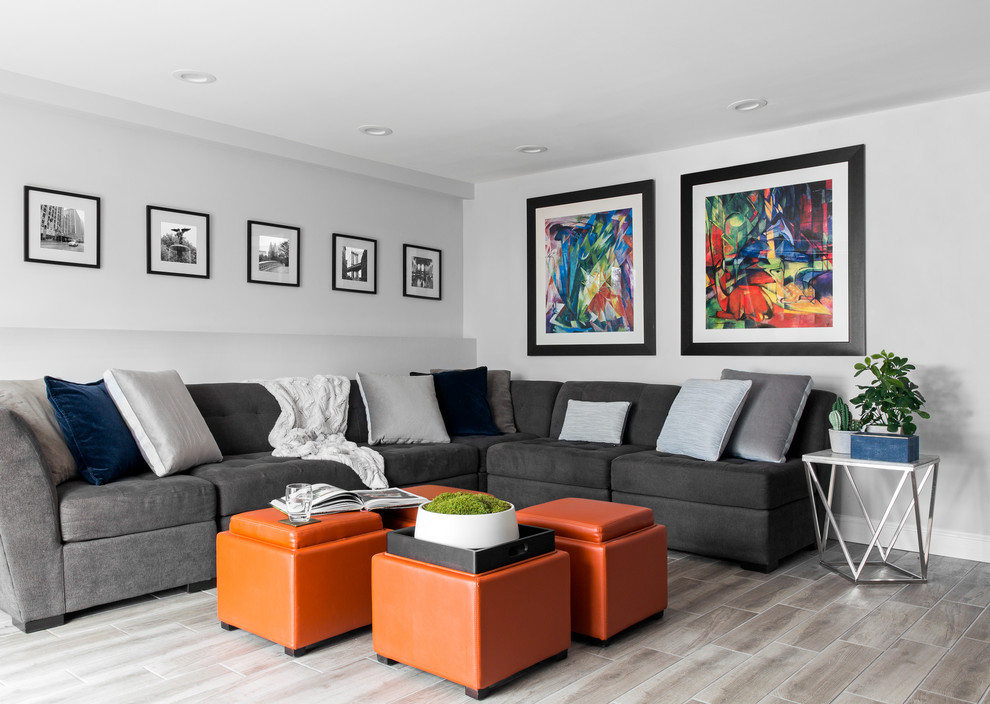 Mid-sized minimalist open concept porcelain tile and brown floor family room library photo in New York with white walls, no fireplace and a wall-mounted tv