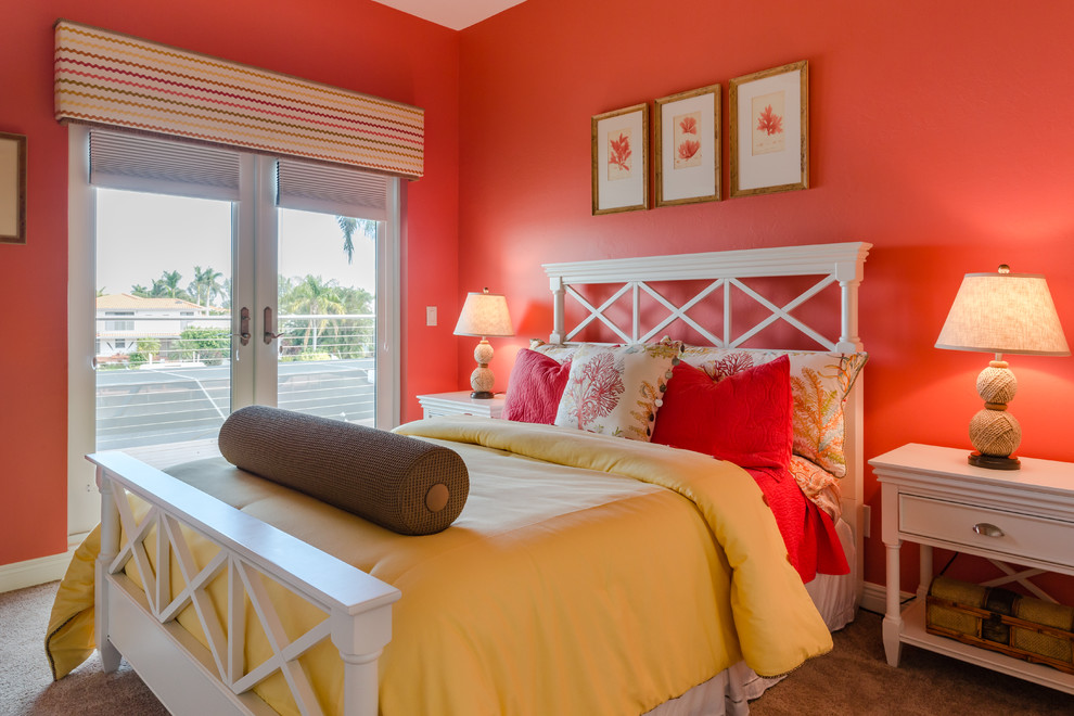 Inspiration for a mid-sized beach style guest bedroom in Miami with orange walls, carpet, beige floor and no fireplace.