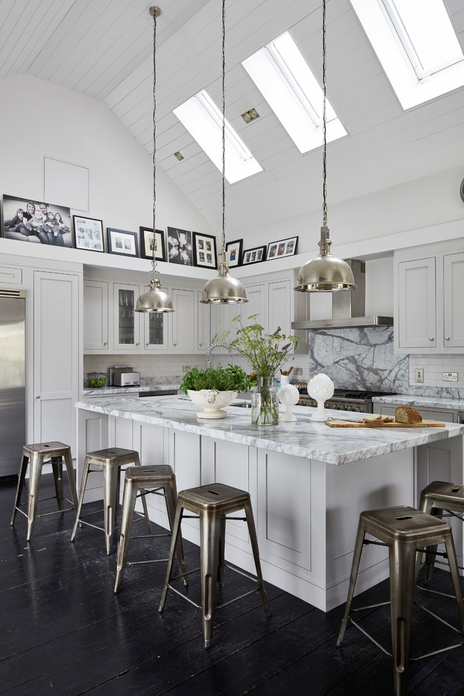 This is an example of a large classic l-shaped kitchen in Dublin with grey cabinets, marble worktops, white splashback, marble splashback, dark hardwood flooring, an island, shaker cabinets and brown floors.