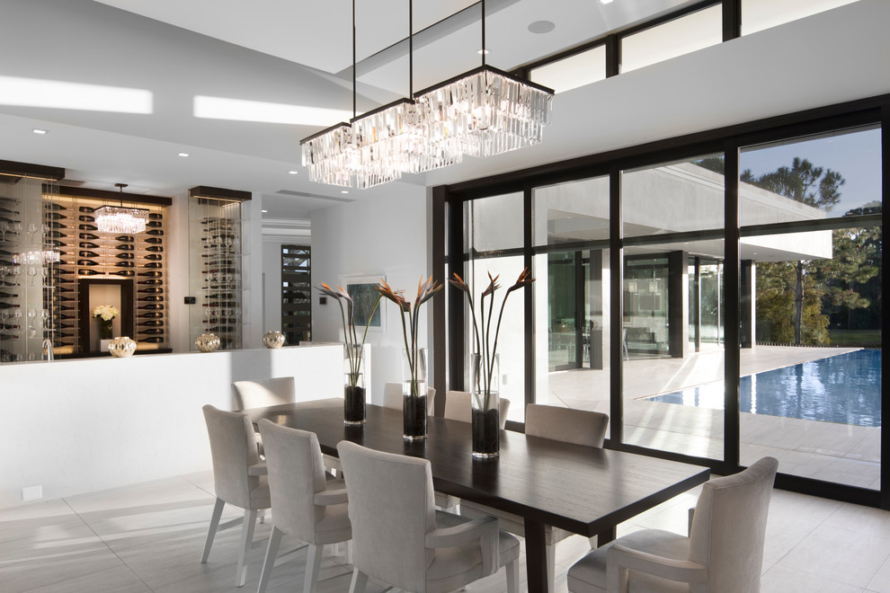 Inspiration for a mid-sized contemporary dining room in Orlando with light hardwood floors.