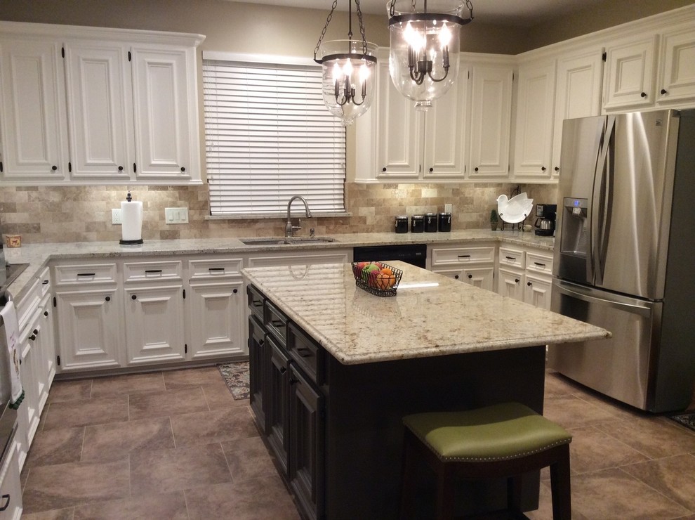 Mid-sized transitional u-shaped kitchen photo in Houston with white cabinets and an island
