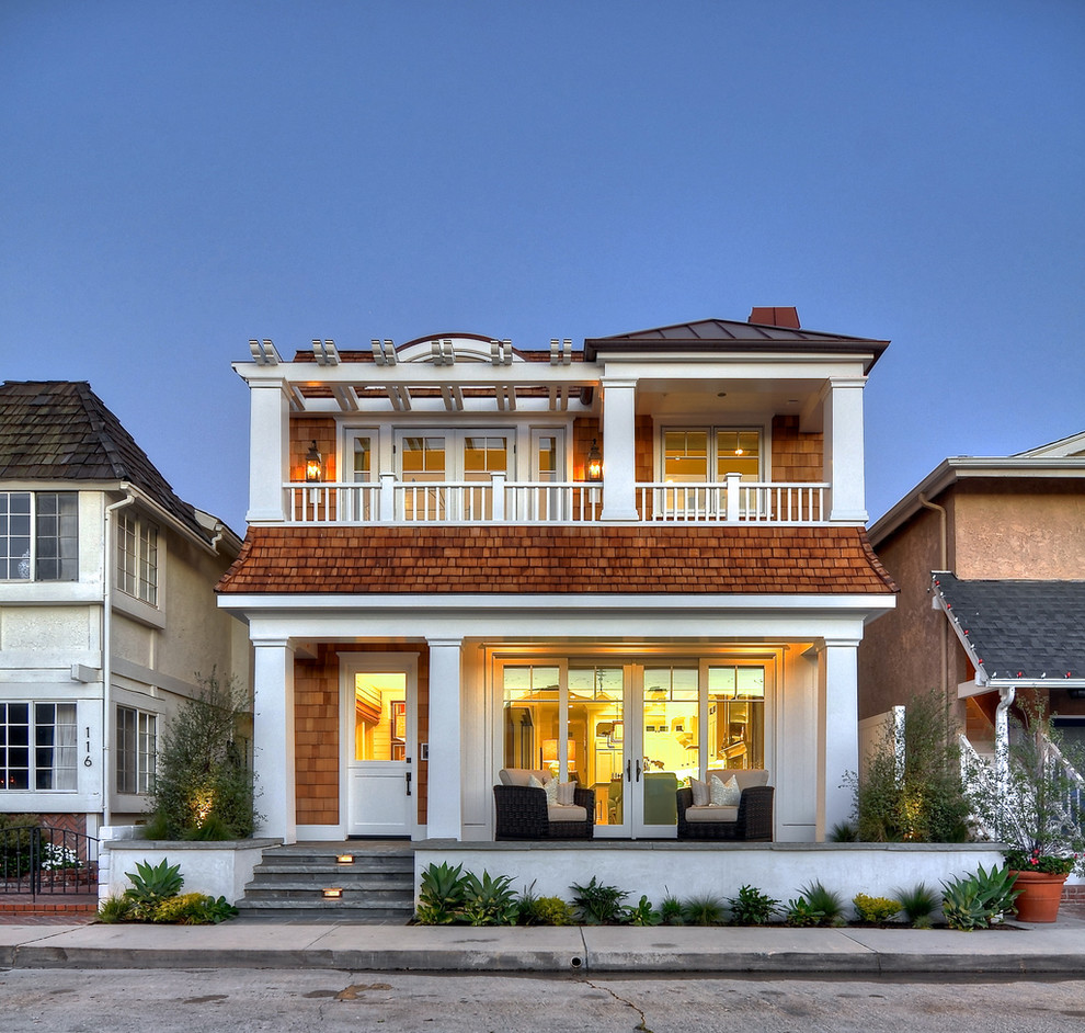 Mid-sized beach style two-storey exterior in Orange County.