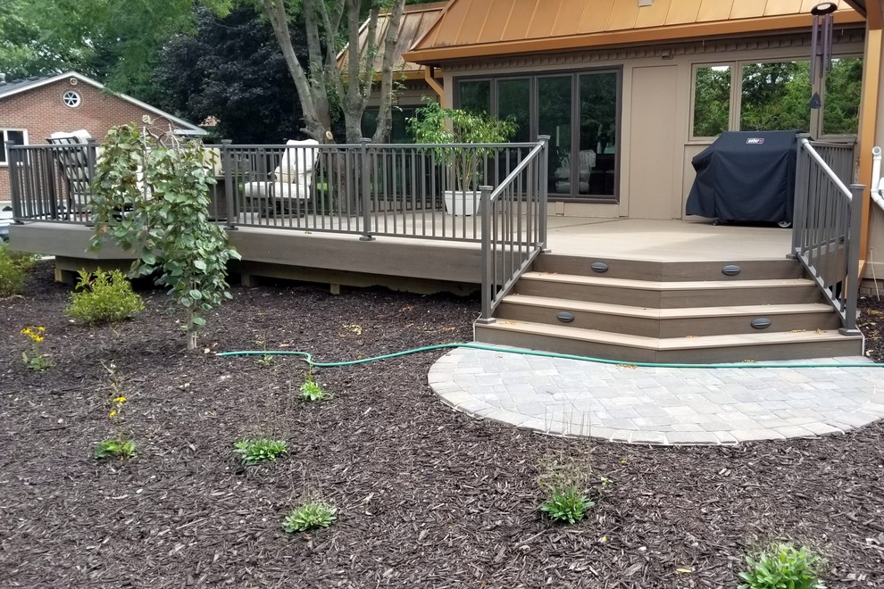 Inspiration for a large backyard deck remodel with no cover
