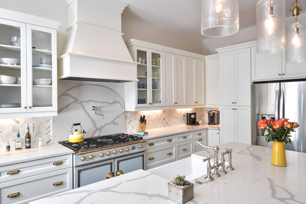 Design ideas for a large traditional u-shaped kitchen in Atlanta with a farmhouse sink, shaker cabinets, quartz benchtops, marble splashback, stainless steel appliances and with island.
