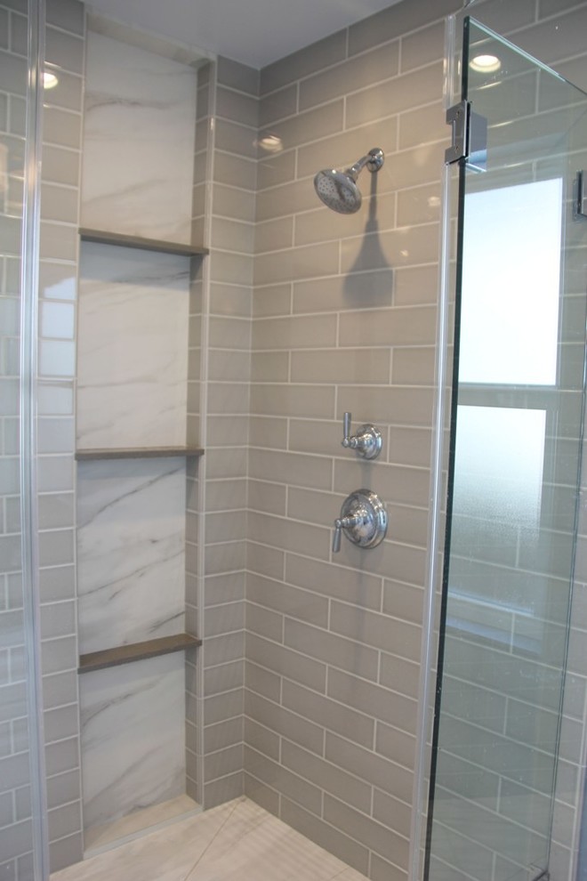 This is an example of a mid-sized transitional 3/4 bathroom in Los Angeles with raised-panel cabinets, white cabinets, a drop-in tub, a corner shower, blue walls, a trough sink and solid surface benchtops.