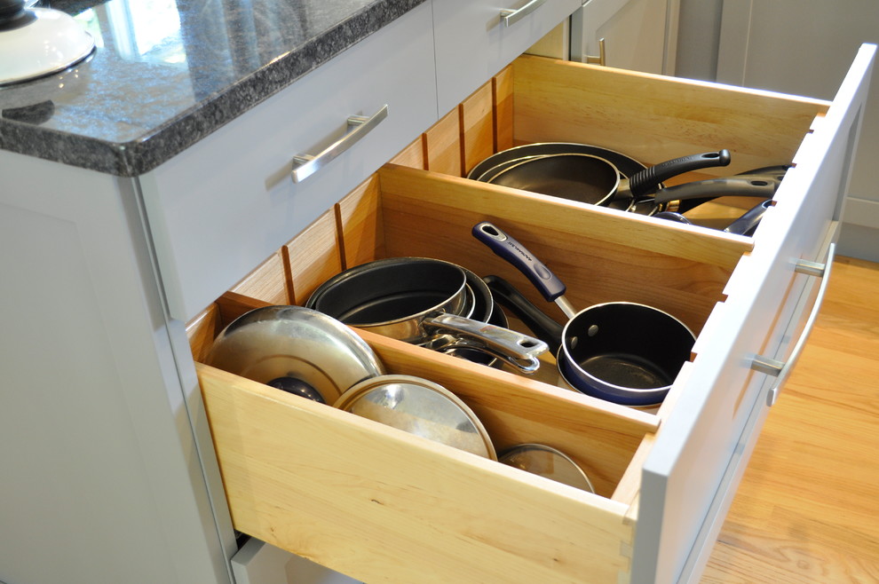 Example of a small transitional galley eat-in kitchen design in Burlington with shaker cabinets, gray cabinets, granite countertops, marble backsplash, stainless steel appliances and a peninsula