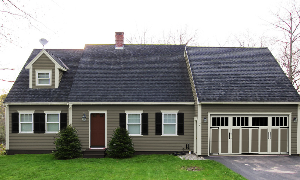 Photo of a small traditional one-storey beige exterior in New York with wood siding.