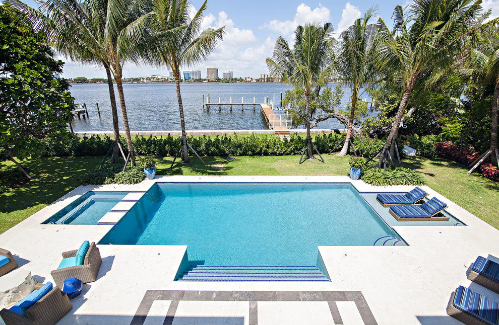 Hot tub - huge transitional backyard rectangular hot tub idea in Miami