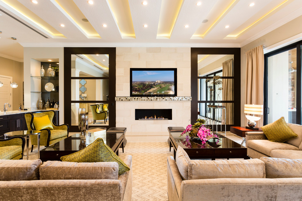 This is an example of a large transitional open concept living room in Orlando with beige walls, a ribbon fireplace, a tile fireplace surround, a built-in media wall and carpet.
