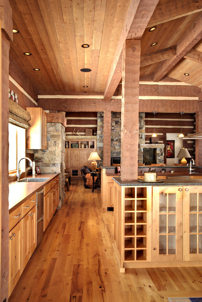 Kitchen pantry - mid-sized rustic u-shaped light wood floor kitchen pantry idea with a drop-in sink, flat-panel cabinets, light wood cabinets, concrete countertops, gray backsplash, stone slab backsplash, stainless steel appliances and two islands