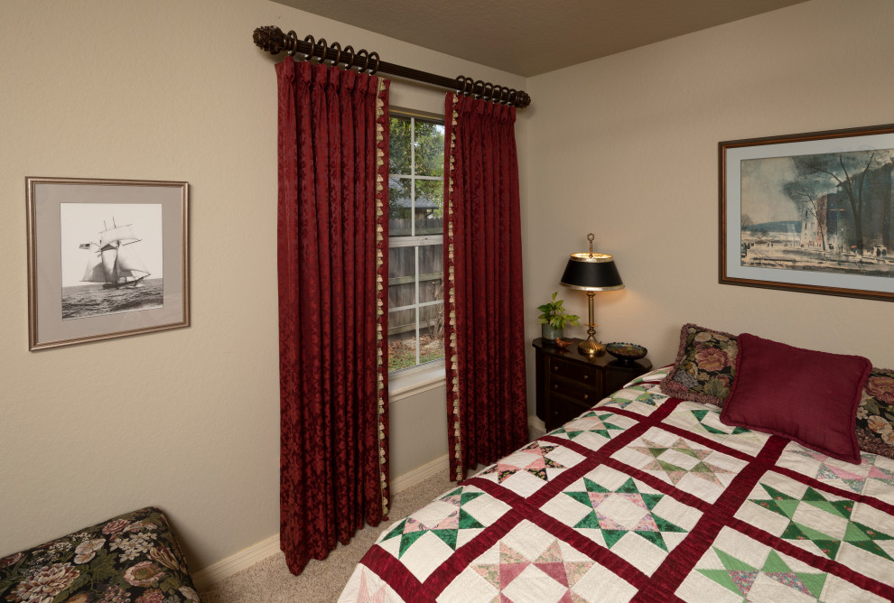 Medium sized traditional guest bedroom in DC Metro with beige walls, carpet and beige floors.