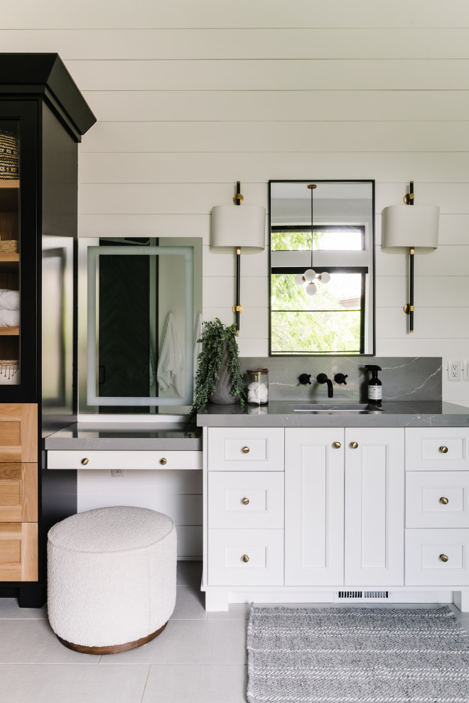 This is an example of a transitional bathroom in Salt Lake City with recessed-panel cabinets, white cabinets, white walls, an undermount sink, grey benchtops, a single vanity and a built-in vanity.
