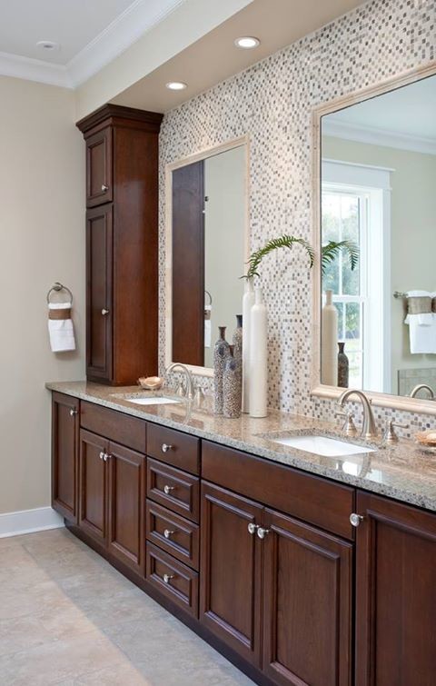 Photo of a transitional bathroom in Charleston with raised-panel cabinets, medium wood cabinets, an alcove tub, a double shower, a one-piece toilet and beige tile.