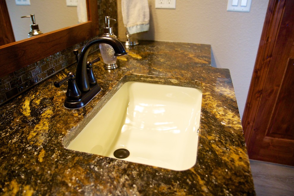 Mid-sized master multicolored tile bathroom photo with a wall-mount sink, raised-panel cabinets and granite countertops