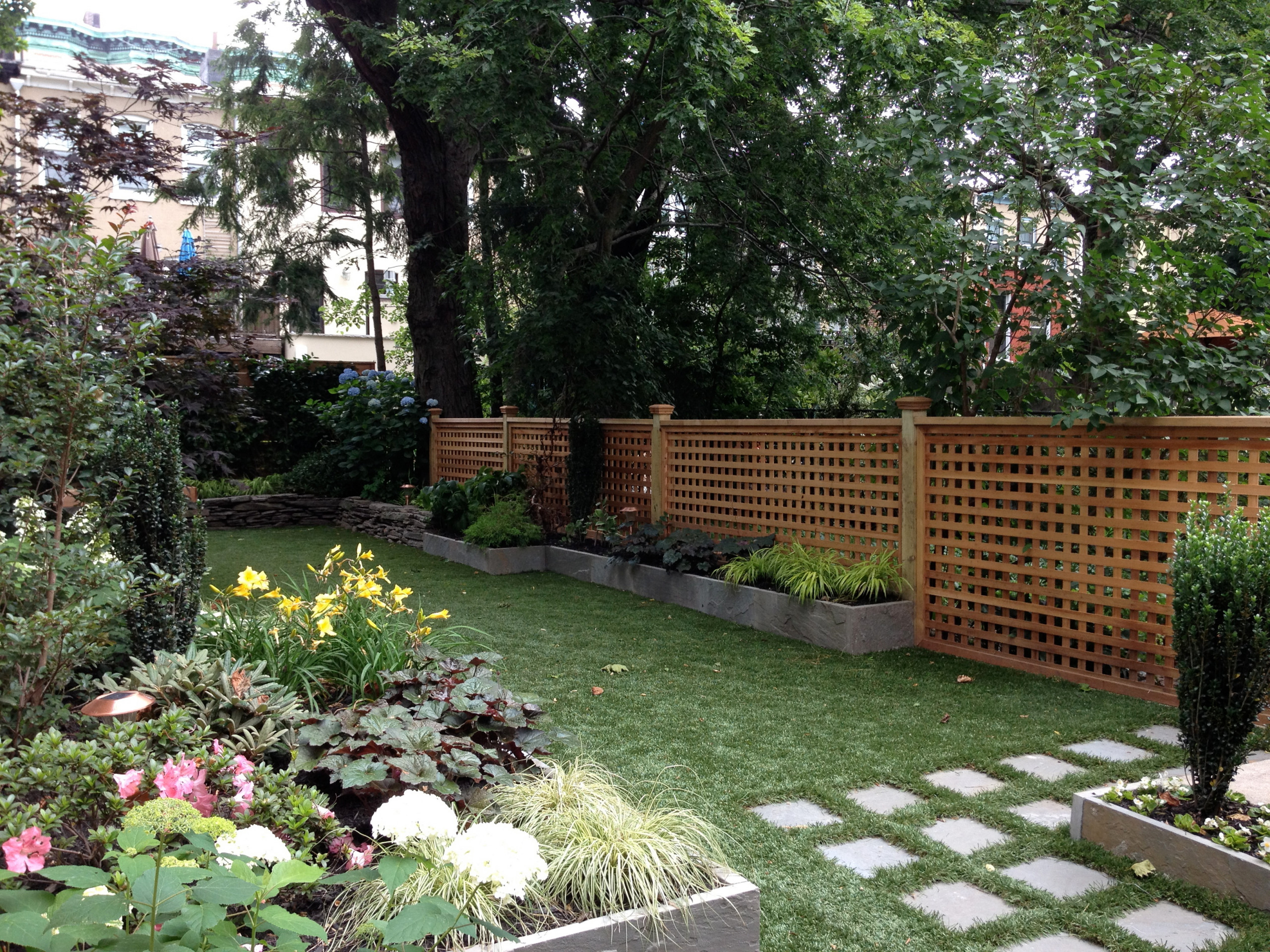 Synthetic Grass and Bluestone Raised Beds