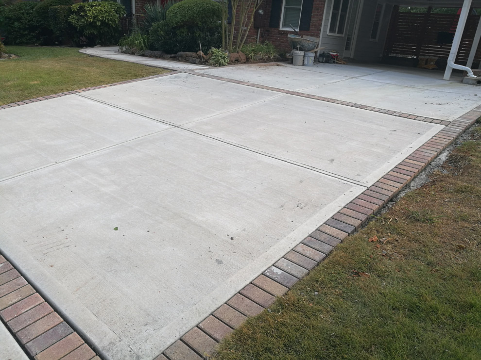 Driveway and sidewalk replacement with custom brick inlay Atlanta