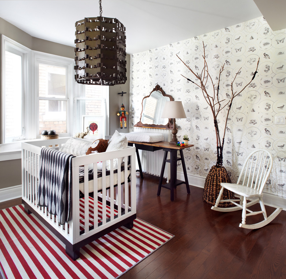 Design ideas for a mid-sized contemporary gender-neutral nursery in Toronto with grey walls and dark hardwood floors.