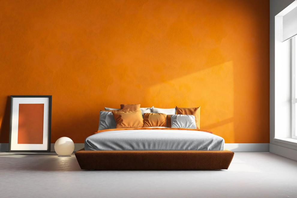 Photo of a large contemporary master bedroom in Chicago with orange walls, no fireplace and white floor.
