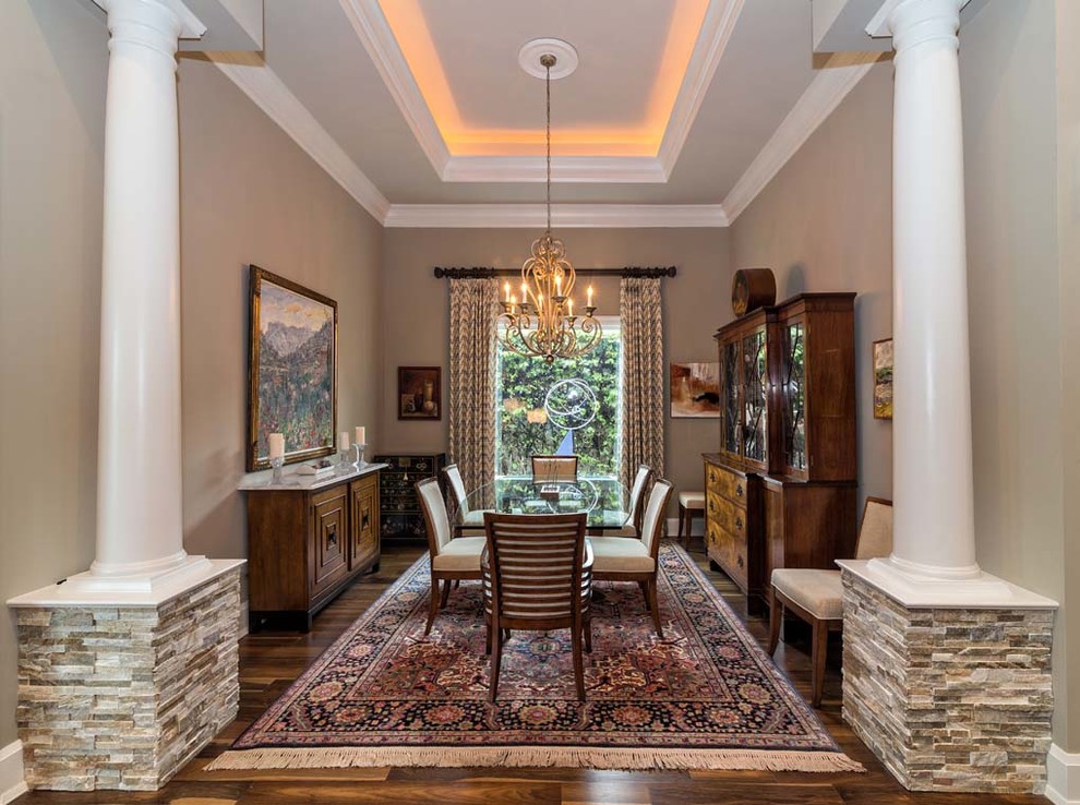 Inspiration for a large transitional separate dining room in Miami with beige walls, dark hardwood floors and no fireplace.