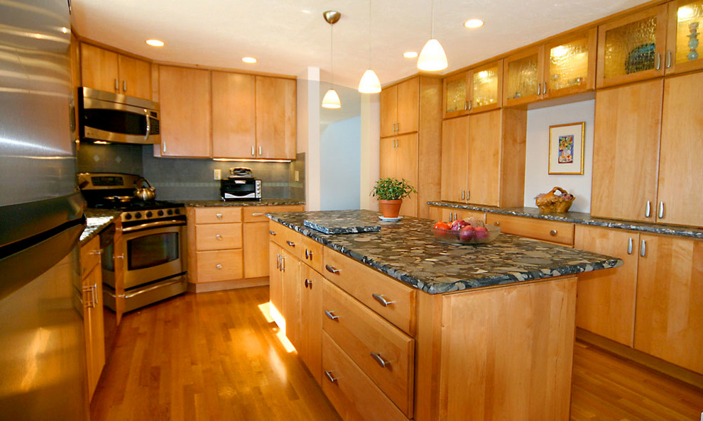 Kitchen pantry - mid-sized u-shaped kitchen pantry idea in Boston with an undermount sink, flat-panel cabinets, light wood cabinets, granite countertops, gray backsplash, ceramic backsplash, stainless steel appliances and an island