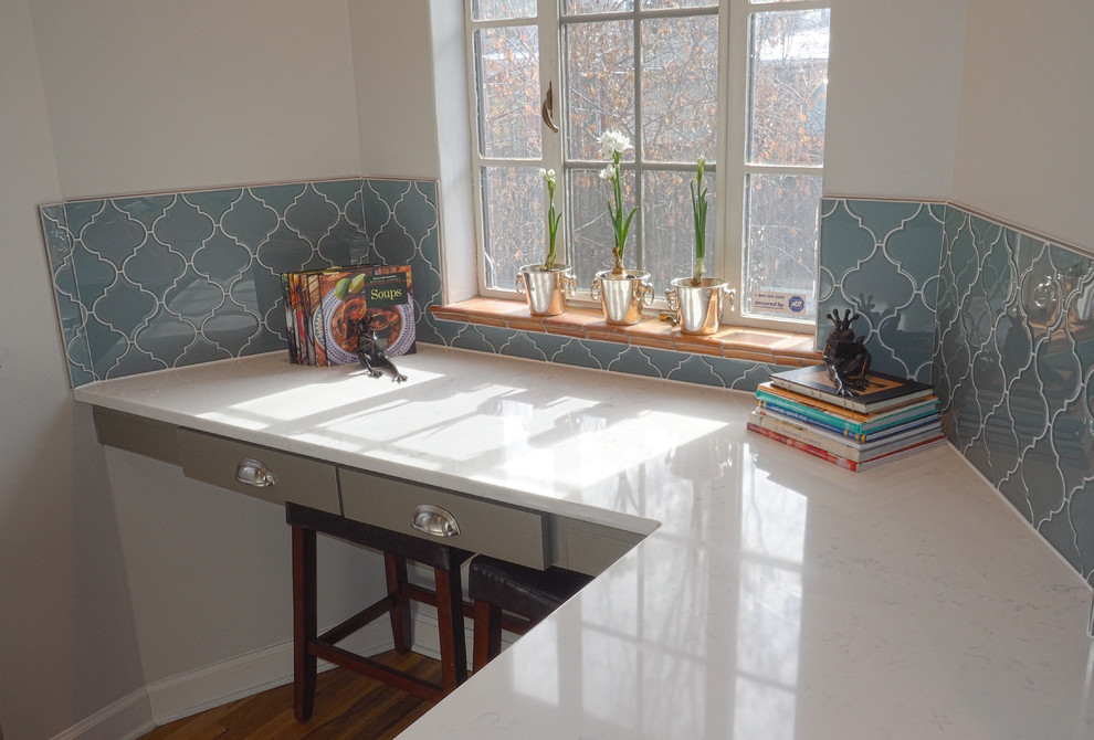 Eat-in kitchen - mid-sized transitional medium tone wood floor eat-in kitchen idea in Denver with gray cabinets, quartz countertops, blue backsplash, glass tile backsplash, an undermount sink, recessed-panel cabinets and stainless steel appliances
