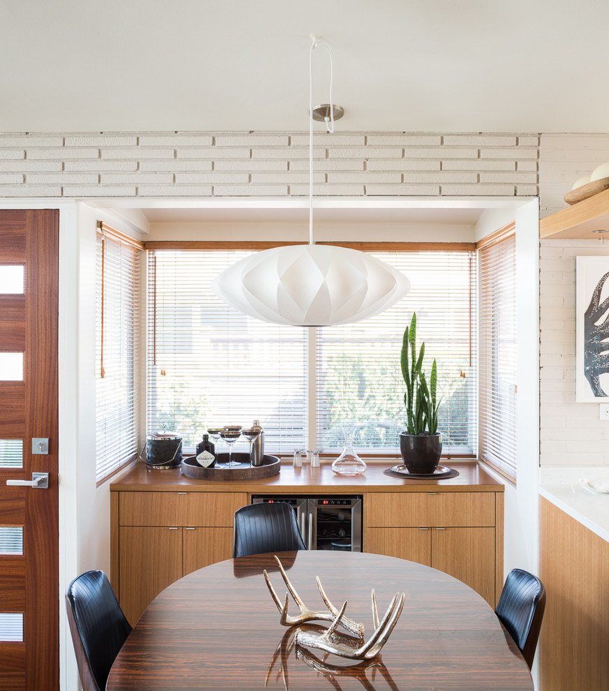 Mid-century modern kitchen/dining room combo photo in Seattle