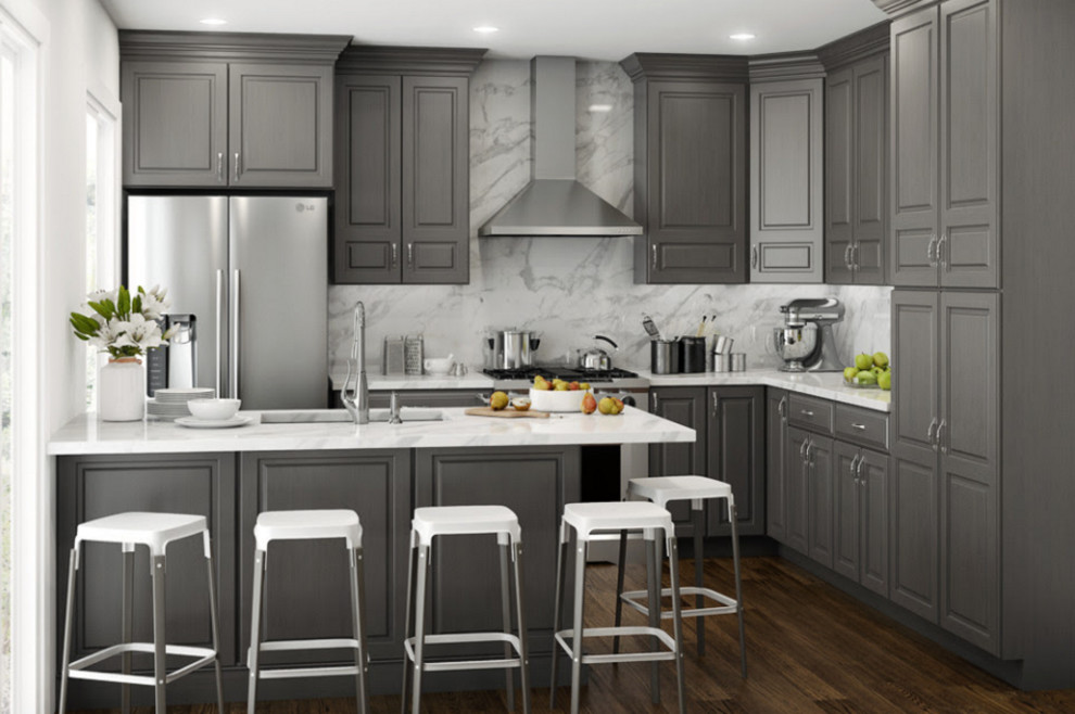 Mid-sized transitional l-shaped dark wood floor eat-in kitchen photo in Indianapolis with an undermount sink, raised-panel cabinets, gray cabinets, marble countertops, marble backsplash, stainless steel appliances and a peninsula