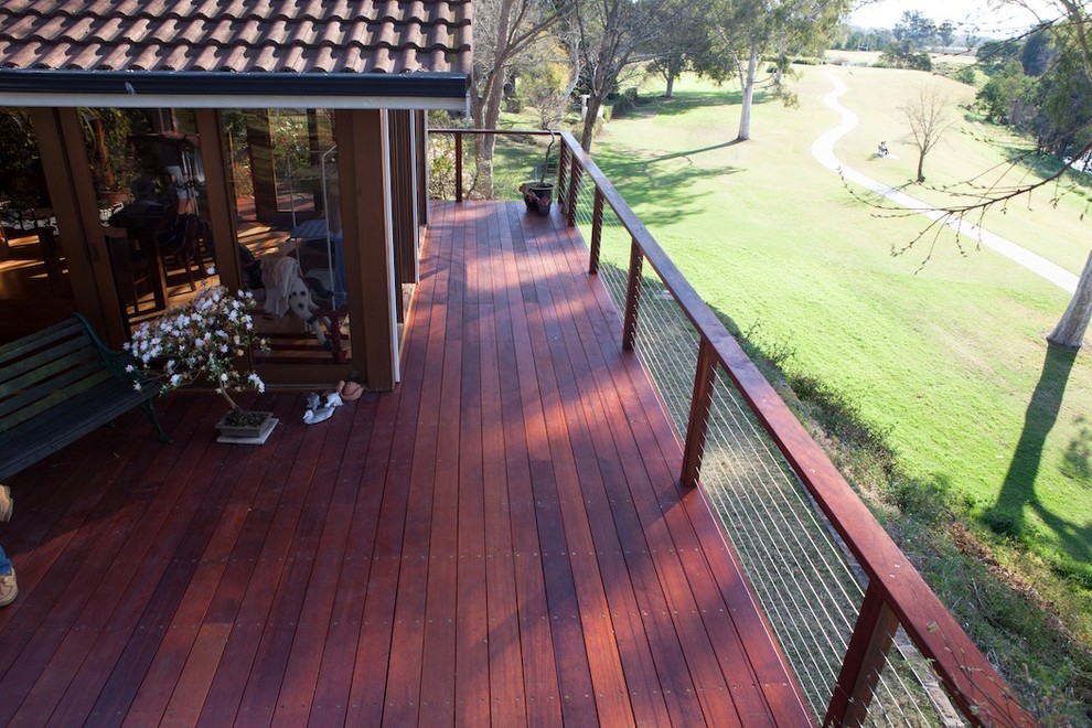 Inspiration for a large country backyard deck in Sydney with no cover.
