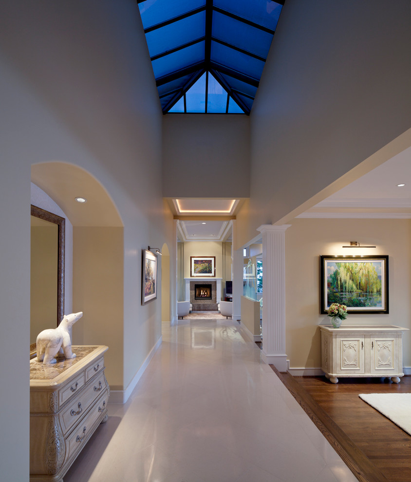 Inspiration for a contemporary hallway in Vancouver with beige walls and grey floor.