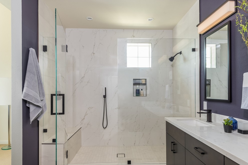 Inspiration for a mid-sized contemporary master bathroom in San Francisco with flat-panel cabinets, dark wood cabinets, a one-piece toilet, white tile, porcelain tile, purple walls, porcelain floors, an undermount sink, engineered quartz benchtops, beige floor and a hinged shower door.