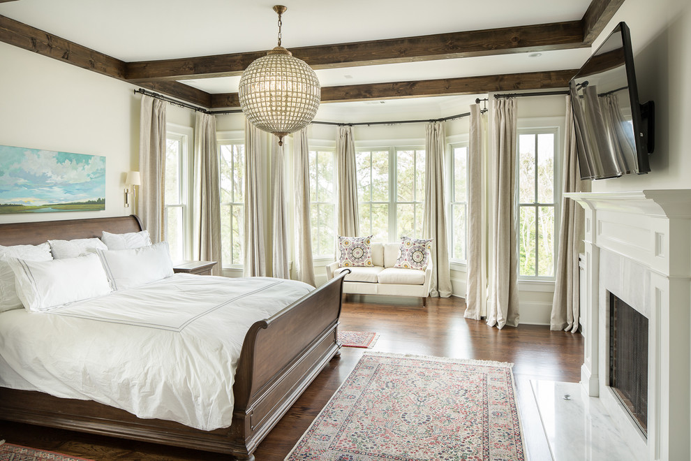 Inspiration for a traditional bedroom in Atlanta with white walls, dark hardwood floors and a standard fireplace.