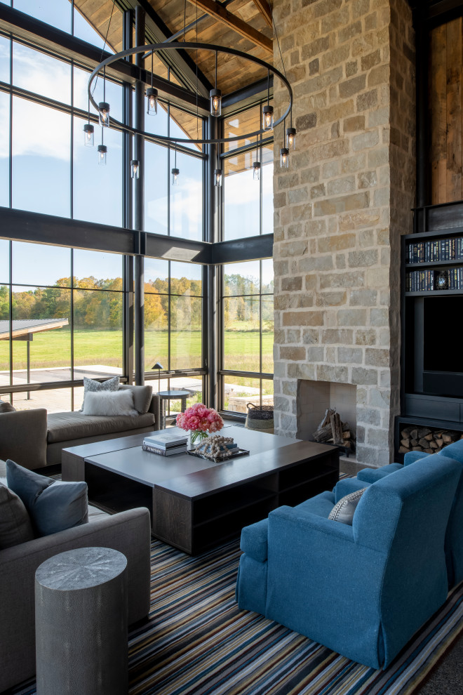 Country family room in Minneapolis with a corner fireplace and a stone fireplace surround.