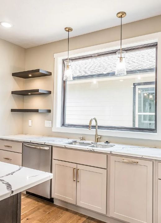 Inspiration for a mid-sized timeless l-shaped medium tone wood floor and brown floor eat-in kitchen remodel with an undermount sink, recessed-panel cabinets, gray cabinets, quartz countertops, stainless steel appliances, an island and white countertops