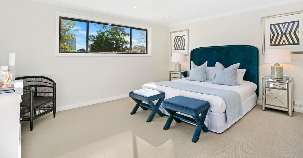 Design ideas for a mid-sized contemporary master bedroom in Sydney with beige walls and carpet.