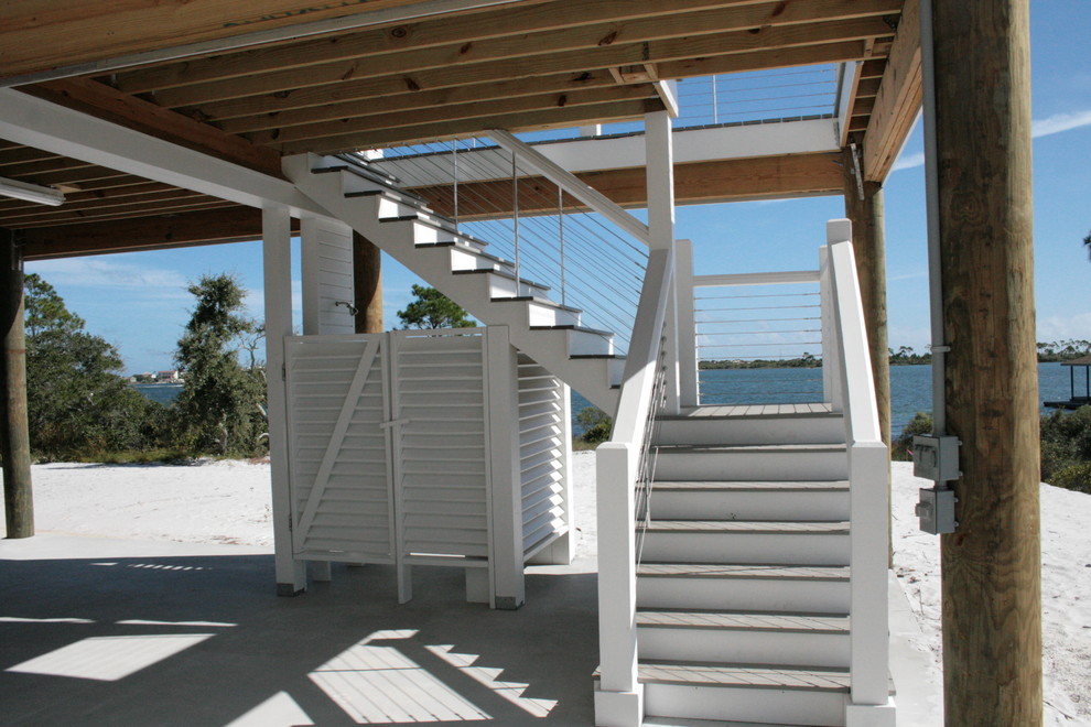 Design ideas for a beach style l-shaped staircase in Other.