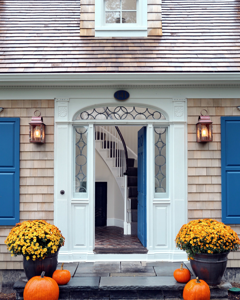 This is an example of a traditional front door in Boston with a single front door and a blue front door.