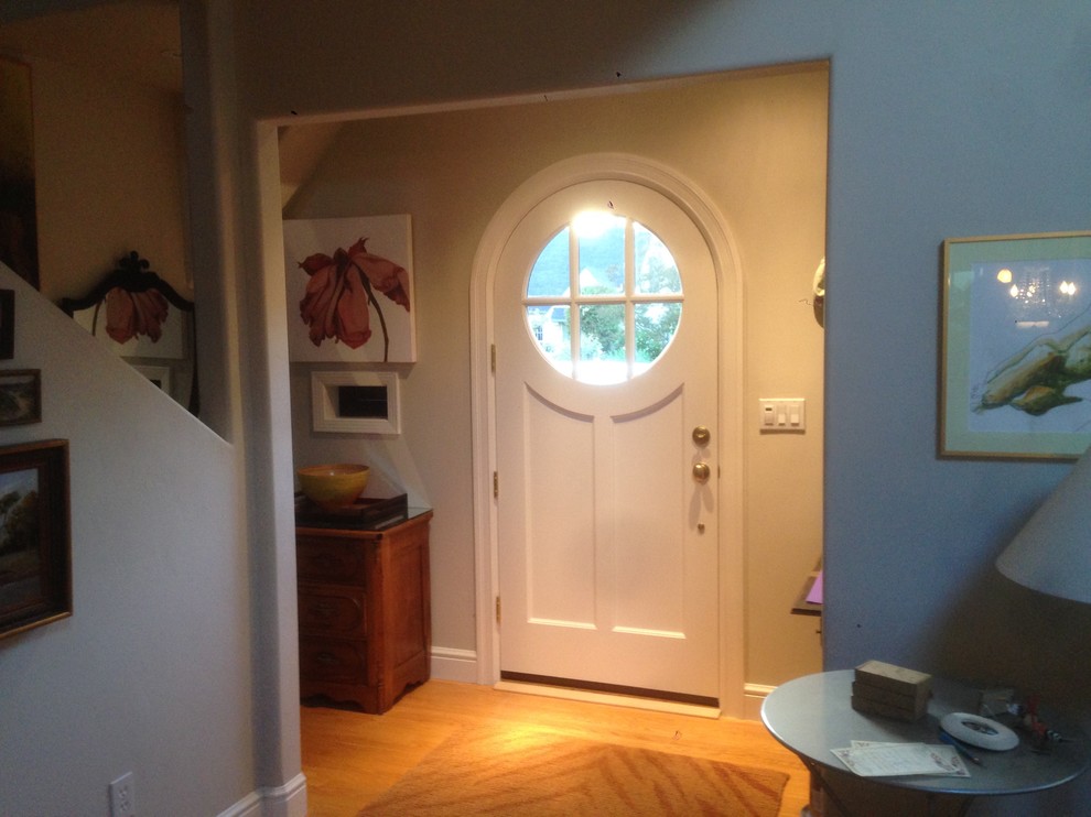 Large traditional front door in San Francisco with a single front door, a white front door and light hardwood floors.