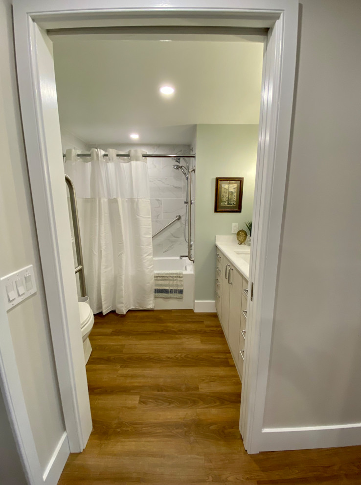Inspiration for a mid-sized transitional vinyl floor, brown floor and wainscoting hallway remodel in Philadelphia with gray walls