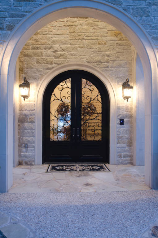 Inspiration for an expansive traditional two-storey white exterior in Austin with stone veneer.