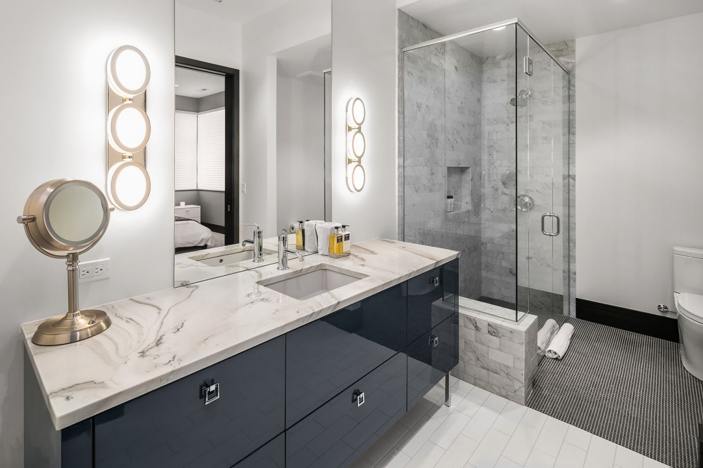 Mid-sized contemporary 3/4 bathroom in Denver with flat-panel cabinets, blue cabinets, a corner shower, a two-piece toilet, gray tile, subway tile, white walls, an undermount sink, black floor, a hinged shower door, multi-coloured benchtops, a niche, a single vanity and a freestanding vanity.