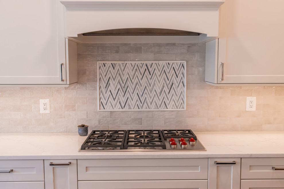 Eat-in kitchen - large transitional u-shaped medium tone wood floor and brown floor eat-in kitchen idea in Baltimore with a farmhouse sink, shaker cabinets, blue cabinets, quartz countertops, white backsplash, marble backsplash, stainless steel appliances, an island and white countertops